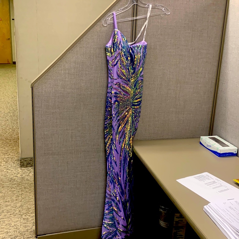 Beautiful hemmed Jovani gown! My daughter is 5’3 was $650 and the hem was $130